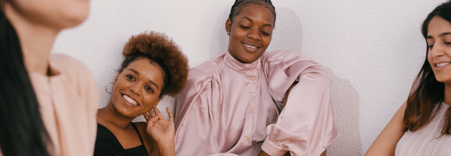 Women gathered in conversation, representing friendship dynamics, emotional influence, and the importance of protecting your energy in relationships.